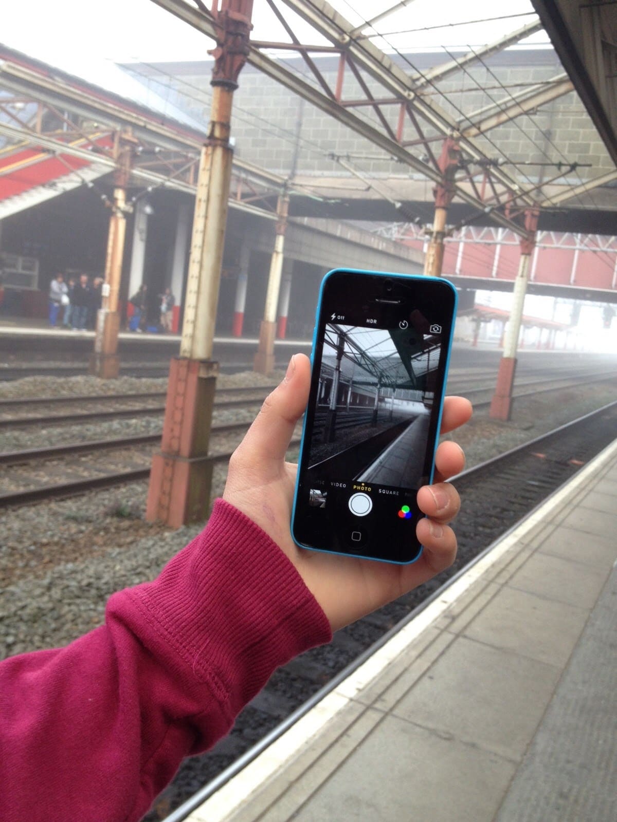 Rail tracks at a local train station, viewed on a mobile phone