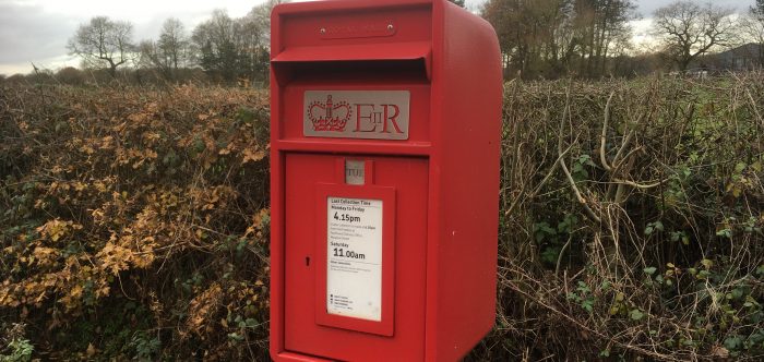 A rural red postbox
