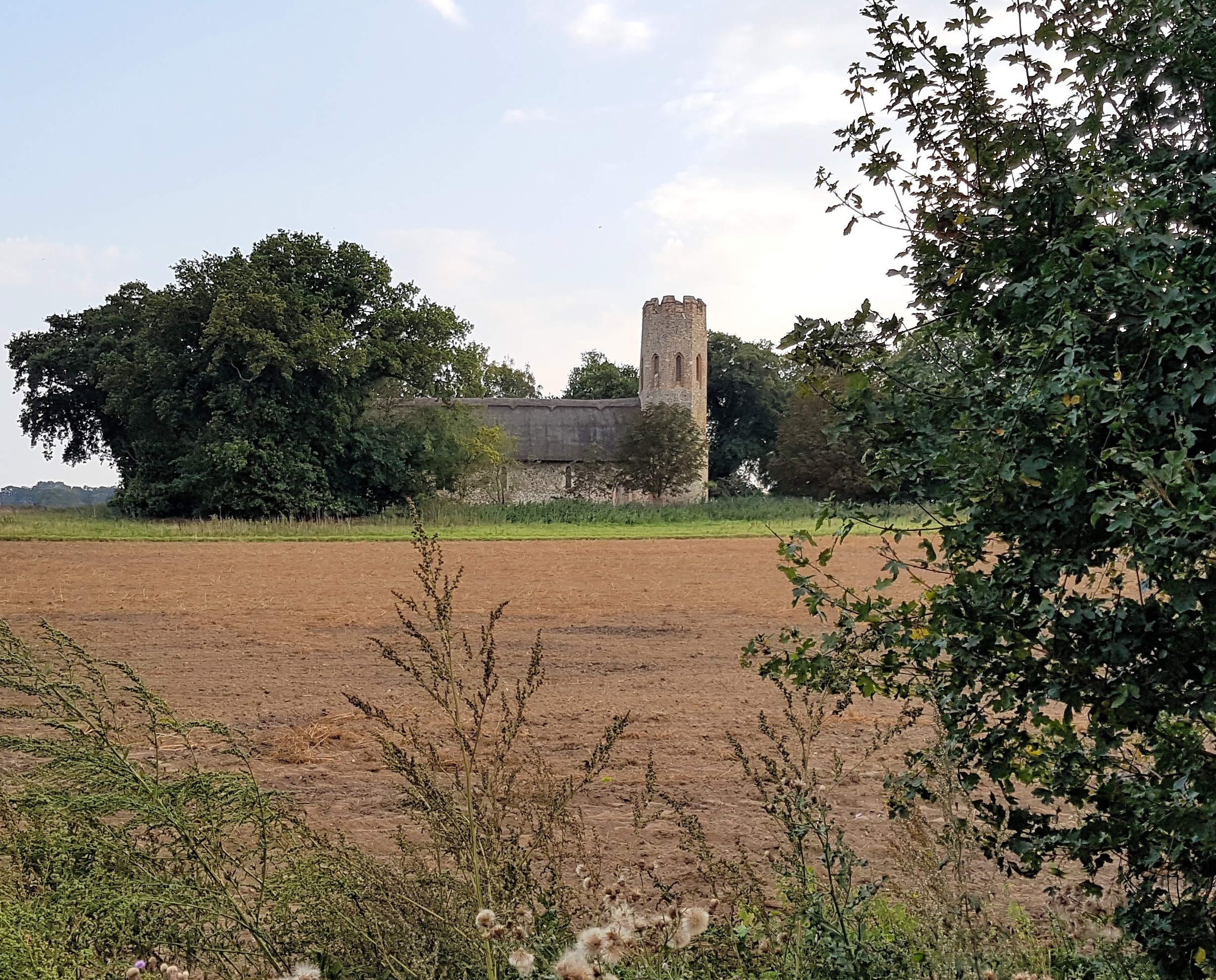 A church surrounded by farmland