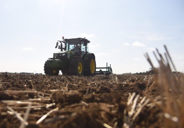 A tractor ploughing a field