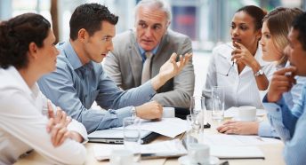 A group of people in a meeting