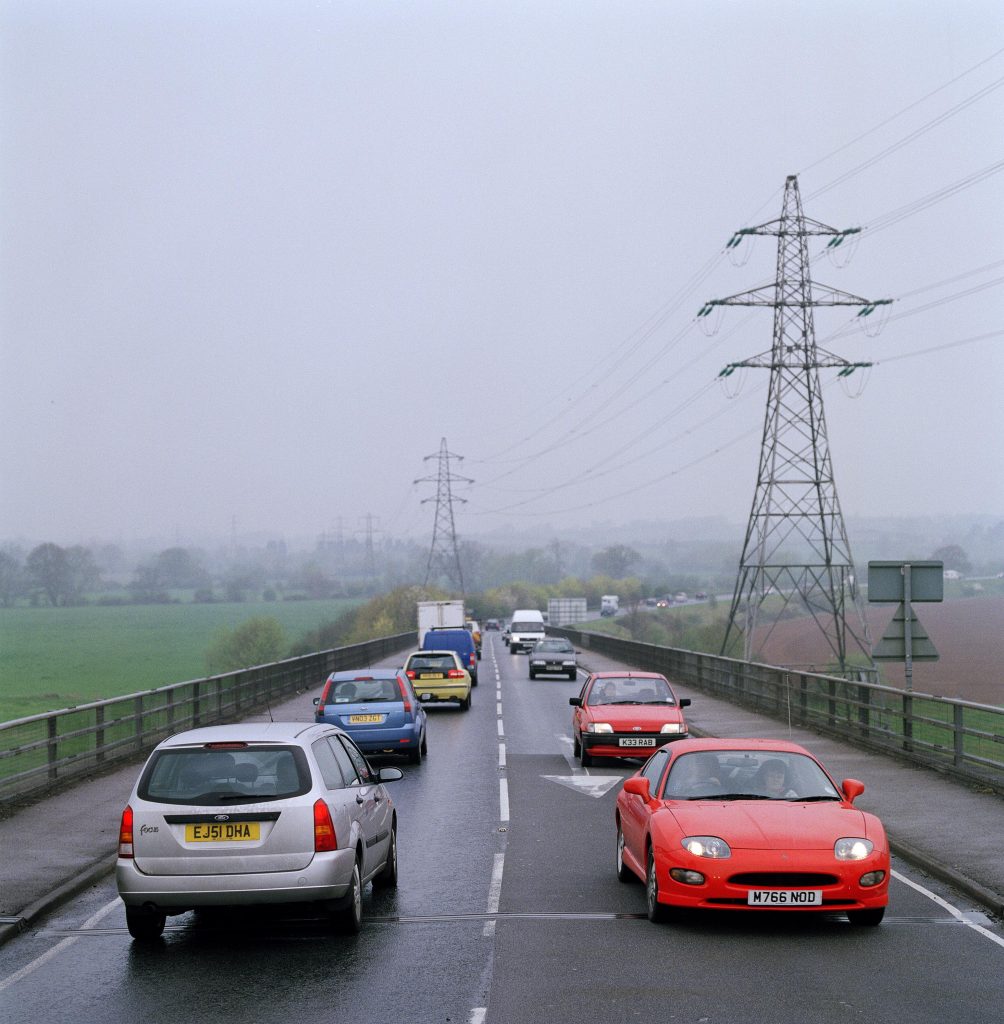 Busy single carriageway road with traffic