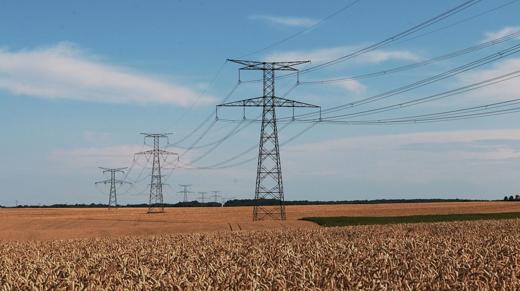 Electricity pylons over farmland
