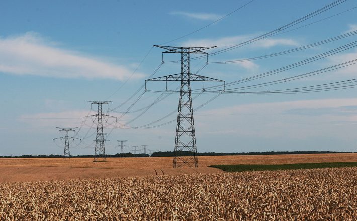 Electricity pylons over farmland
