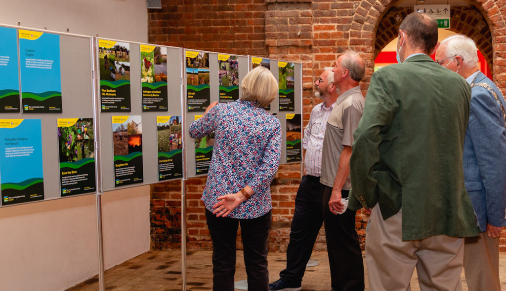 People reading the displays at the CPRE Norfolk Awards 2021
