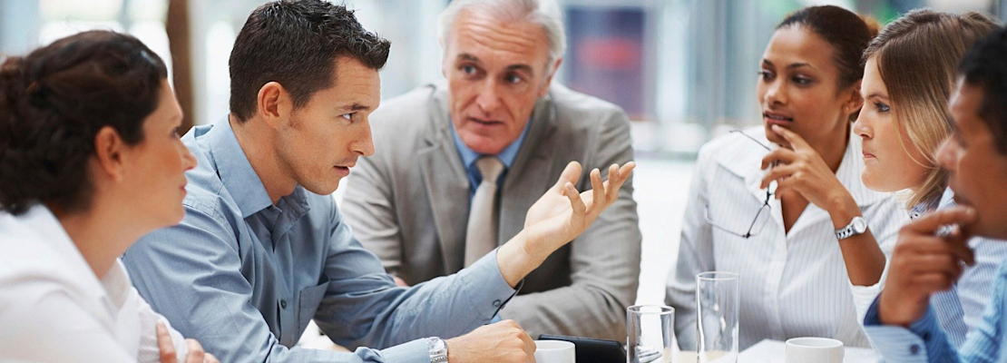 A group of six business people in a meeting