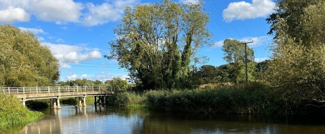 A view of the Wensum valley showing a bridge over a river