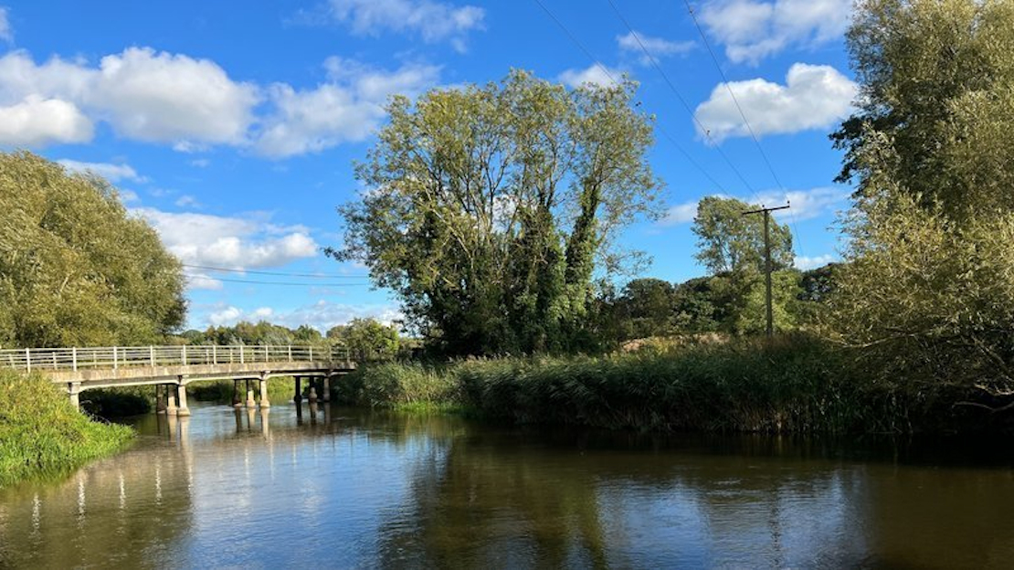 A view of the Wensum valley showing a bridge over a river