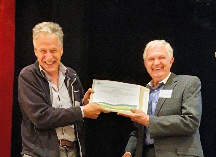 David Hook is presented with a special contribution award by the treasurer, George Ridgway in recognition of his work and long service to CPRE Norfolk.
