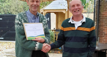 Chris Dady being presented with his award by Kevin Jones.