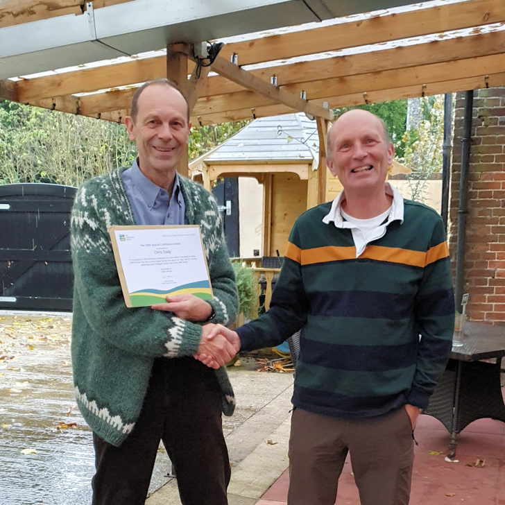 Chris Dady being presented with his award by Kevin Jones.