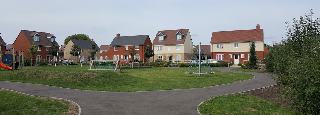 A new housing estate built on a greenfield site.