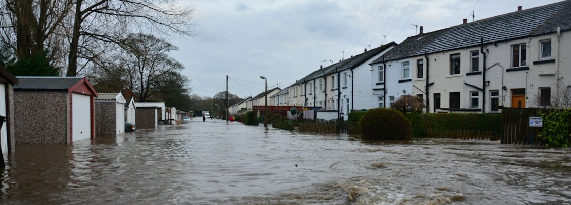 Flooded houses on a road in Bingley, West Yorkshire