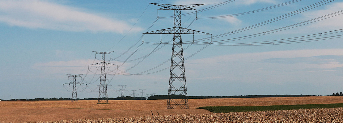 Electricity pylons over farmland