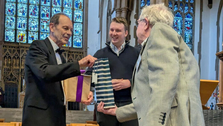 Retiring Chair, Chris Dady, receiving a presentation from George Ridgway with the new Chair, Elliot Griffiths looking on.