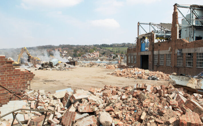 Demolition of a factory and clearing a plot of brownfield land.