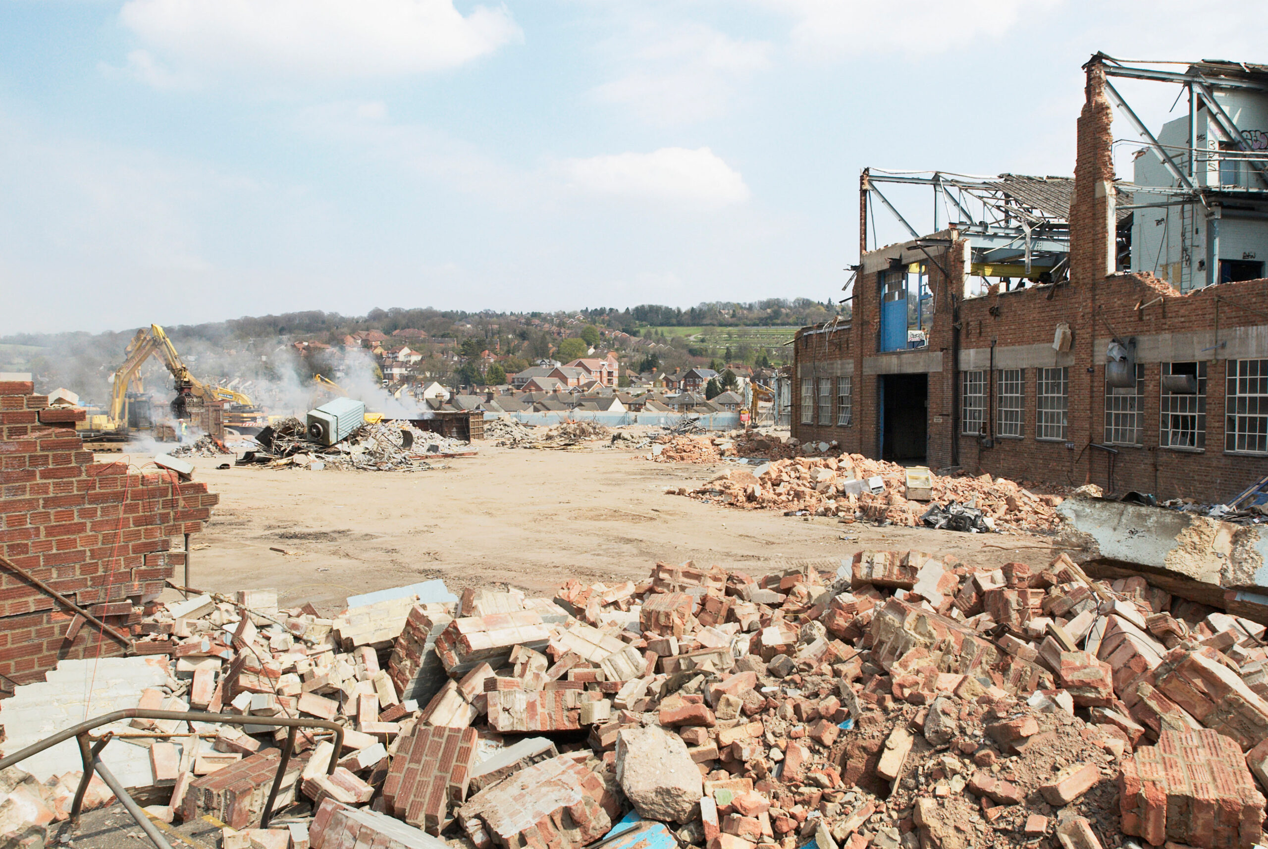Demolition of a factory and clearing a plot of brownfield land.
