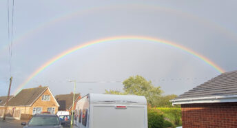 A double rainbow over houses
