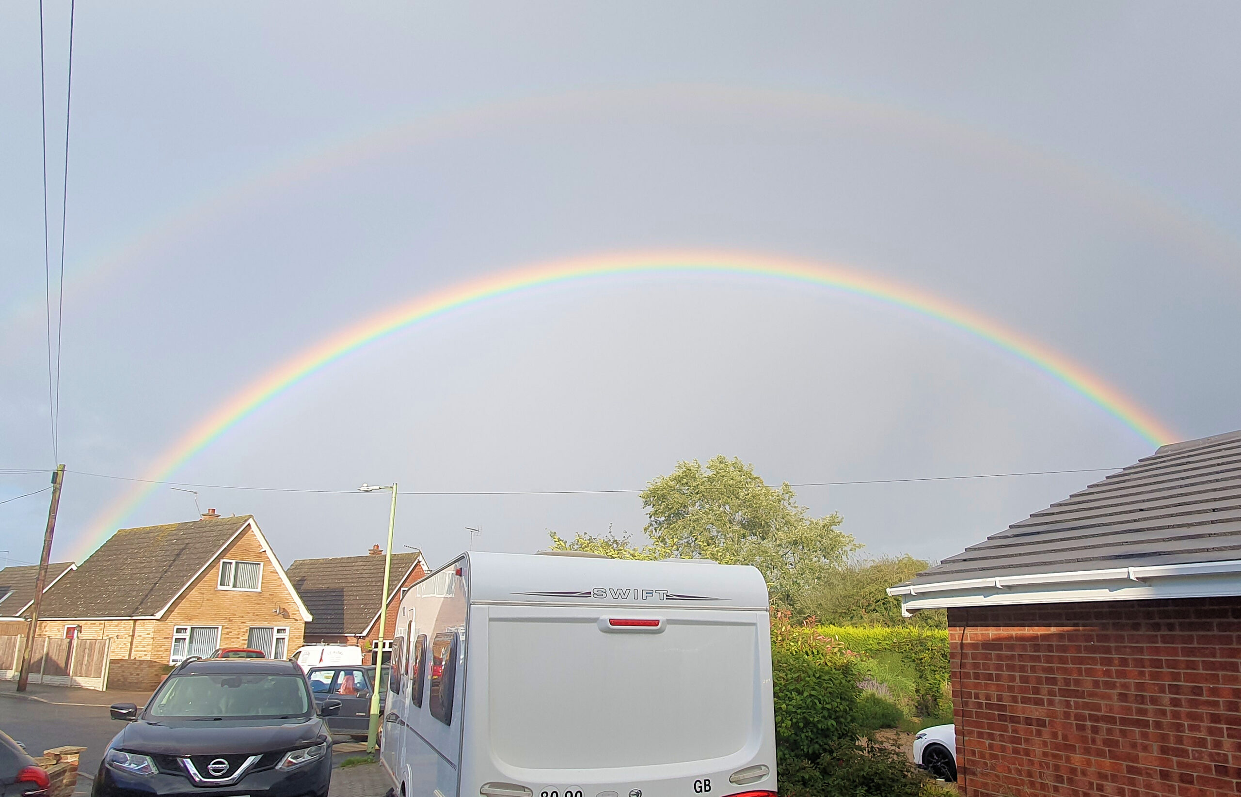 A double rainbow over houses