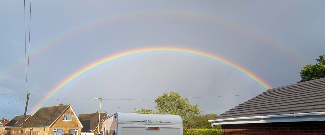 A double rainbow over houses