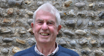 A head and shoulders photo of a smiling Dr Ian Shepherd