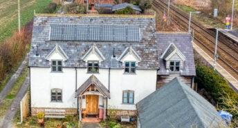 An aerial view of a eco-friendly, new-build house.
