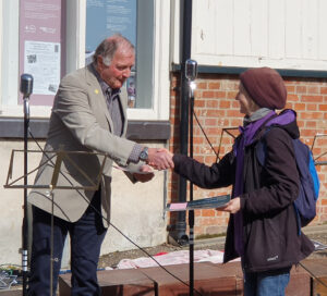 A member of the Little Ouse Headwaters project receiving their Countryside Champion Award certificate from former CPRE Norfolk President Tim O'Riordan
