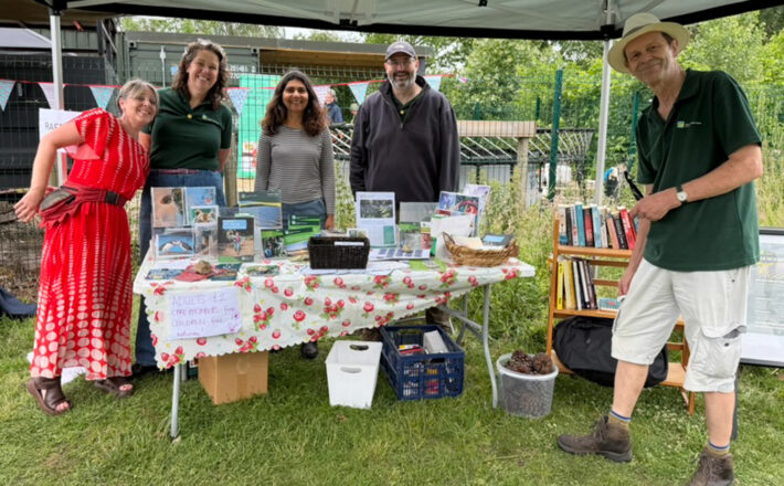 CPRE Norfolk volunteers and staff around their stall at Martha's Meadow