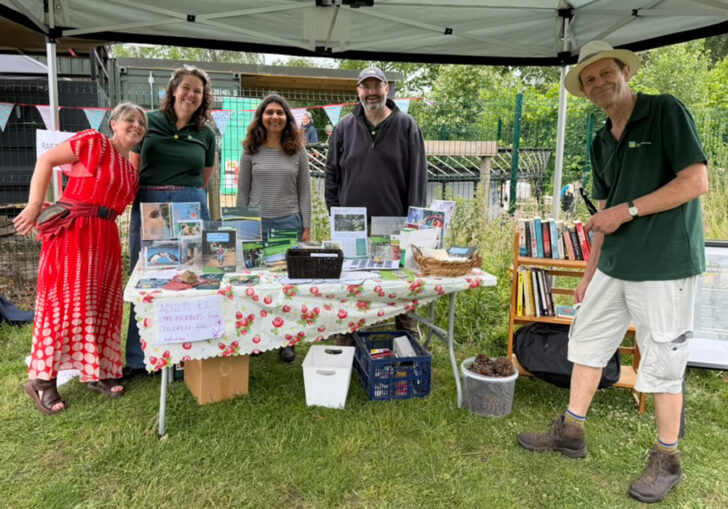 CPRE Norfolk volunteers and staff around their stall at Martha's Meadow