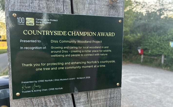 CPRE Norfolk's Countryside Champion Award plaque at the entrance to Quaker Wood, Diss
